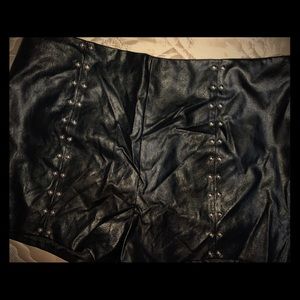 Black faux leather shorts with metal detail